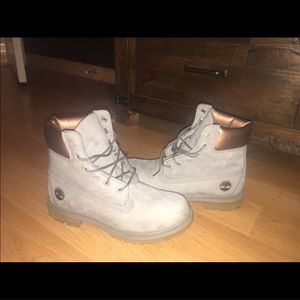 Gray and rose gold timberlands